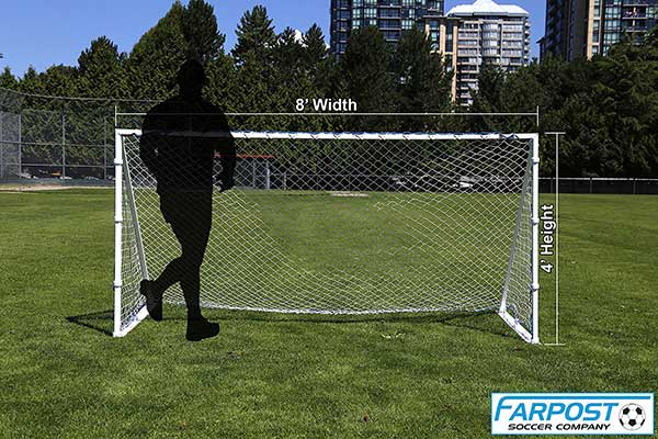Farpost goal with black shadow figure running infront